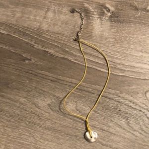 Yellow roped necklace with pendant